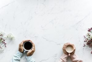 man holding mug